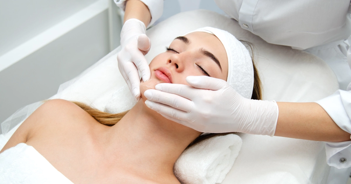 Skincare specialist giving a relaxing facial treatment at a medspa in Charleston, SC.